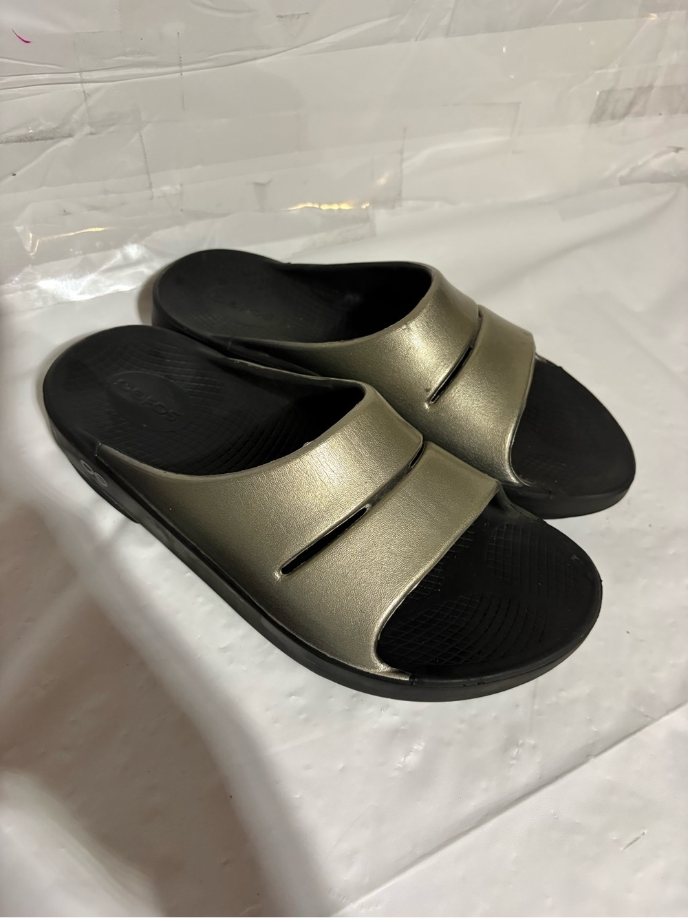 OOFOS Metallic Gold Slide Sandals with Black Footbed